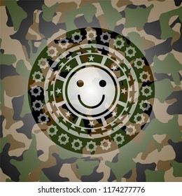 happy face icon inside camo emblem