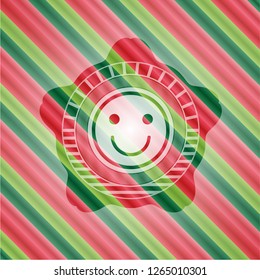 happy face icon inside christmas badge.