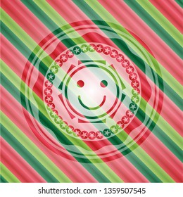 happy face icon inside christmas badge.