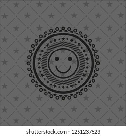 happy face icon inside dark emblem