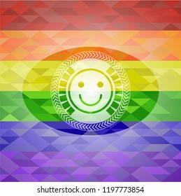 happy face icon inside emblem on mosaic background with the colors of the LGBT flag