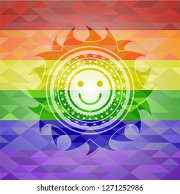 happy face icon inside emblem on mosaic background with the colors of the LGBT flag