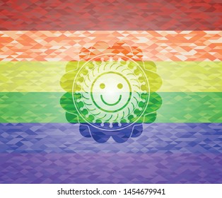 happy face icon inside emblem on mosaic background with the colors of the LGBT flag