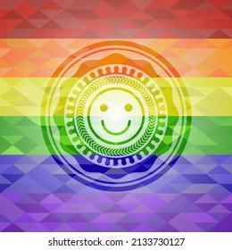 happy face icon inside emblem on mosaic background with the colors of the LGBT flag. 
