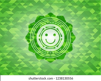 happy face icon inside green mosaic emblem