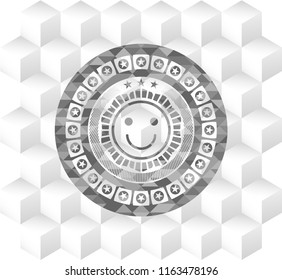 happy face icon inside grey badge with geometric cube white background