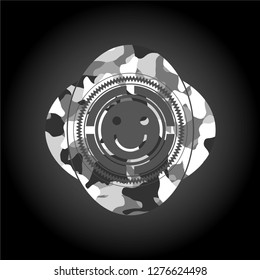 happy face icon inside grey camo emblem