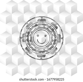 happy face icon inside grey emblem with geometric cube white background