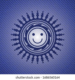 happy face icon inside jean or denim emblem or badge background