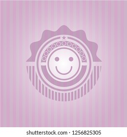 happy face icon inside pink emblem