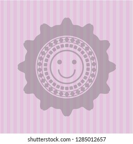 happy face icon inside pink emblem