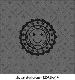 happy face icon inside realistic black emblem