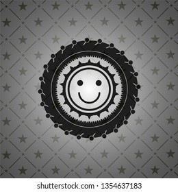 happy face icon inside realistic dark emblem