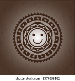 happy face icon inside realistic wooden emblem