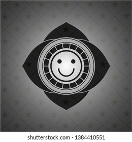 happy face icon inside realistic black emblem