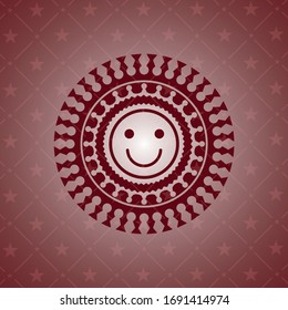 happy face icon inside realistic red emblem