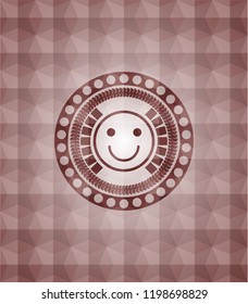 happy face icon inside red seamless emblem with geometric pattern.