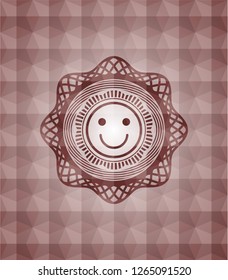 happy face icon inside red seamless geometric badge.