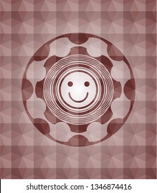 happy face icon inside red seamless emblem or badge with geometric pattern background.