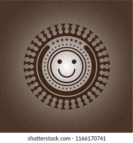 happy face icon inside retro wood emblem