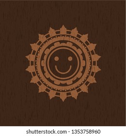happy face icon inside retro style wooden emblem