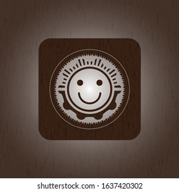 happy face icon inside retro wooden emblem