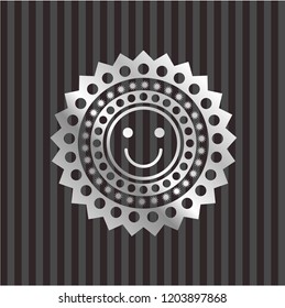 happy face icon inside silver shiny emblem