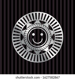 happy face icon inside silvery emblem