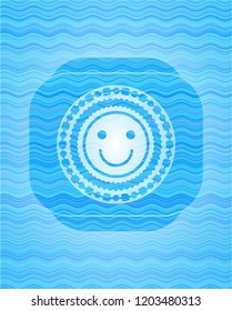 happy face icon inside sky blue water wave badge.