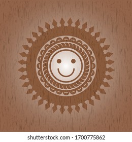 happy face icon inside vintage wooden emblem