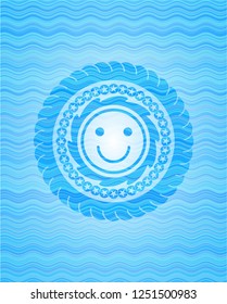 happy face icon inside water concept badge background.