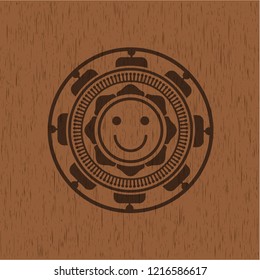 happy face icon inside wood emblem. Retro