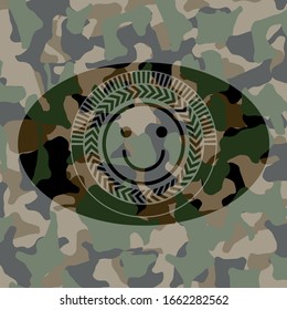 happy face icon on camo texture