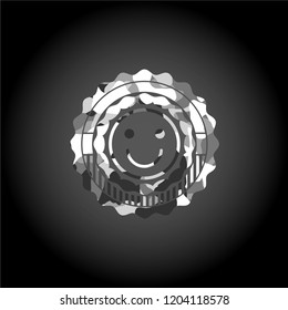 happy face icon on grey camouflaged pattern