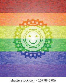 happy face icon on mosaic background with the colors of the LGBT flag