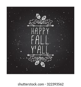 Happy Fall Y'all. Hand-sketched typographic element with acorns on chalkboard background. 