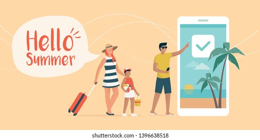 Happy family booking a summer vacation online, the woman is carrying a trolley case and the man is using the booking app on the smartphone