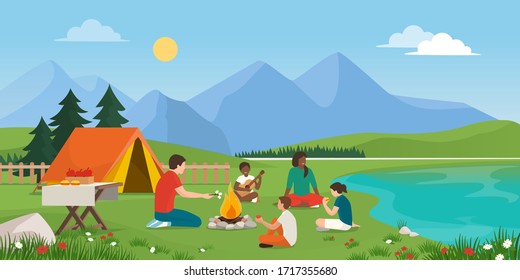 Happy family camping together in nature, they are sitting around a fire, eating together and having fun