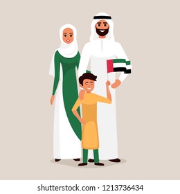 Happy family celebrating the United Arab Emirates Independence Day. Smiling Father, mother and son holding the flag of UAE.