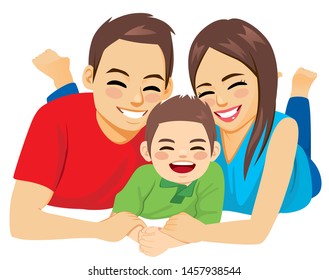 Happy family of dad mom and son lying on the floor together