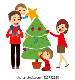 Happy family decorating big Christmas tree together
