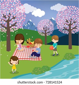 Happy family enjoy spending time together in the mountain watching cherry blossom in spring