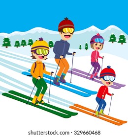 Happy family of four members skiing on snow mountain