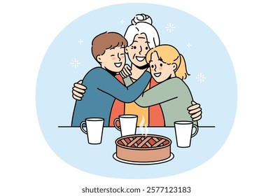 Happy family of grandmother and two little grandchildren hugging sitting at table with hot cake and mugs of tea. Smiling grandmother rejoices at meeting great-grandchildren after long absence