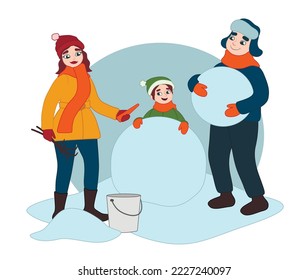 Happy family making snowman on winter day