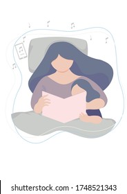 Happy family mother and daughter read a book together and listen to soft music under blanket in the bed at home.