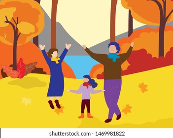 happy family playing with autumn leaves in park