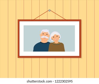 Happy family portrait: smiling grandfather and grandmother on the light blue background in the frame on the brown wall. Vector illustration