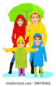 happy family in raincoats standing with umbrella