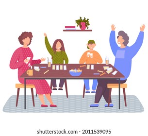 Happy family sitting on chairs near table and playing cards. People drink tea and eat sweets together. Man raised his hands above his head as he won. Mom, dad, son and daughter play board game